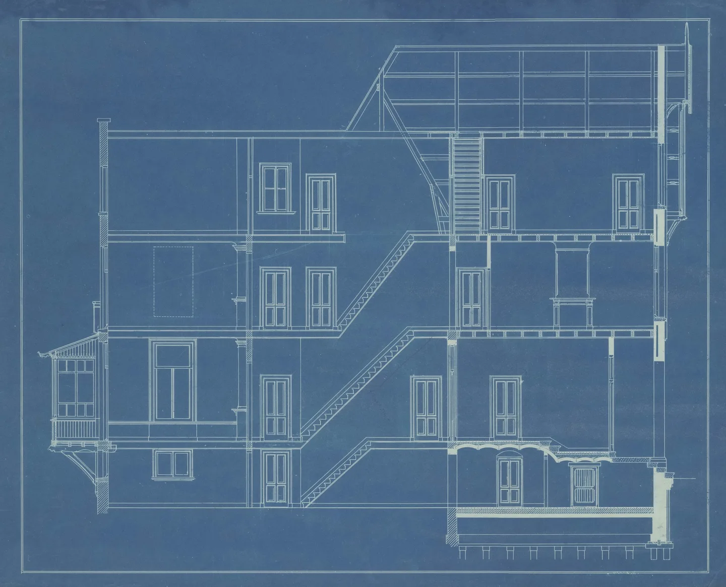 Historic blueprint showing a cross-section of a multi-storey house